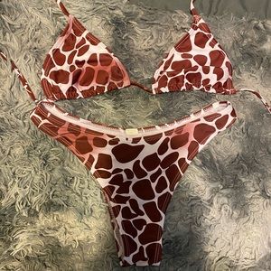 Never been worn cow print bathing suit.